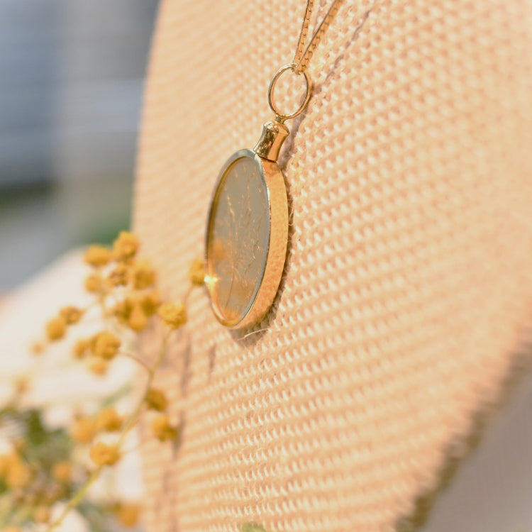 シンプルな 1/4ozメイプルコイントップ